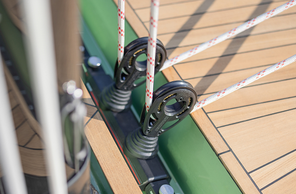 Sailing yacht with crew on deck